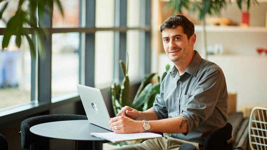 GVSU adult student working on a computer.